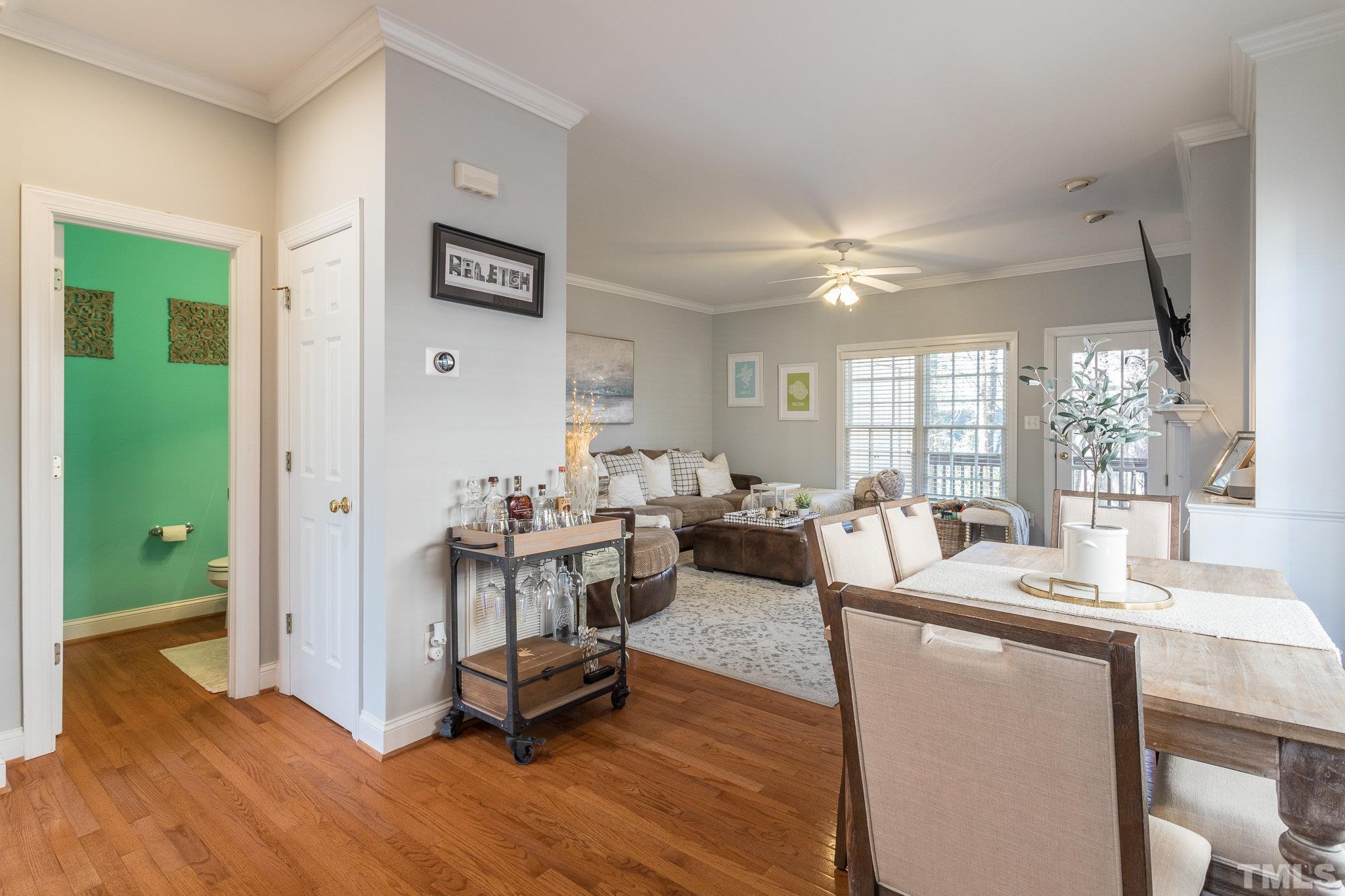 1311 Cameron View Court Raleigh, NC 27607 - Photo 5 of 33 a living room with furniture a large window and a chandelier