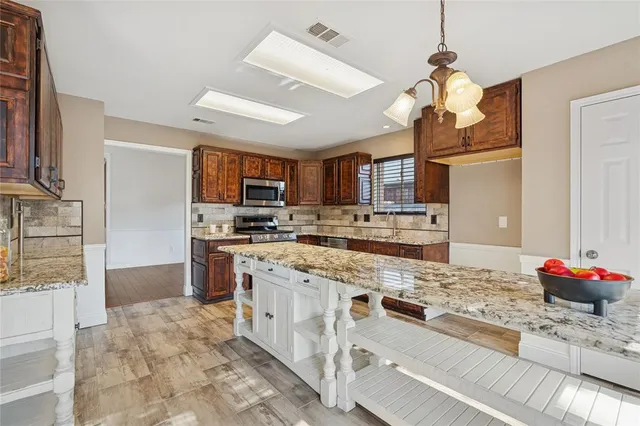 a large kitchen with cabinets