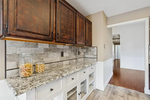 a kitchen with granite countertop cabinets and sink