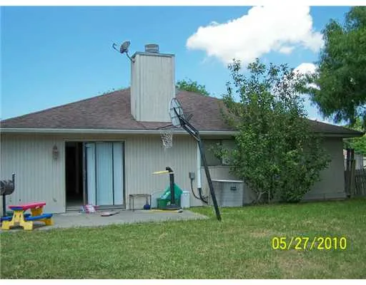 a house view with a garden space