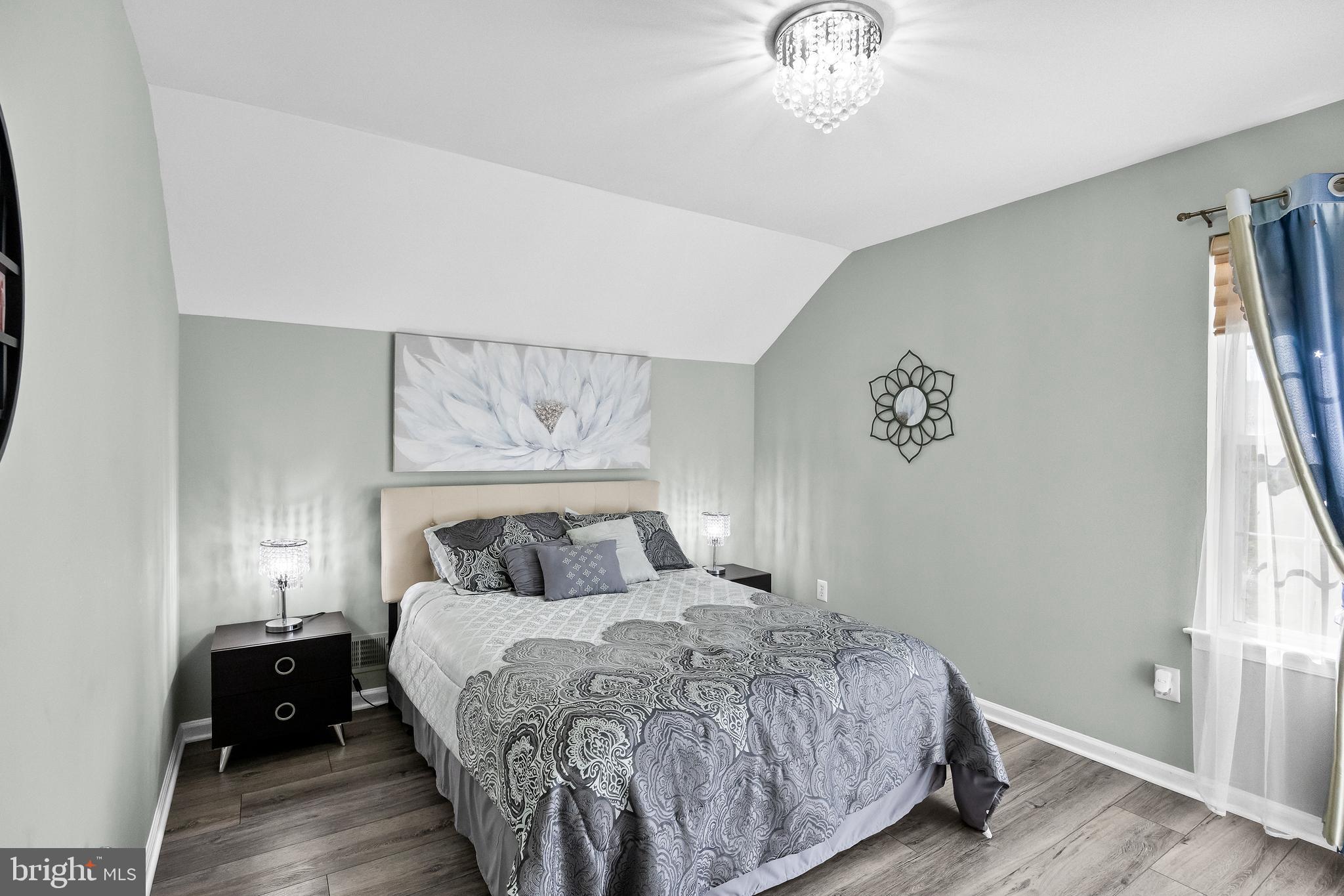 2 Rothbury Drive Lumberton, NJ 08048 - Photo 35 of 54 a bedroom with a bed and a chandelier
