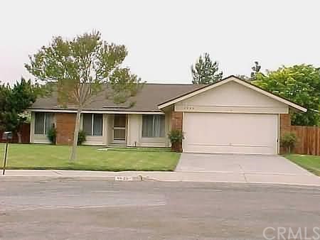 4025 Ballad Place, Unit PL Riverside, CA 92505 - Photo 1 of 1 a white house with a small yard plants and big yard