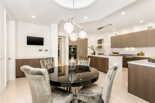 a work room with furniture and a flat screen tv