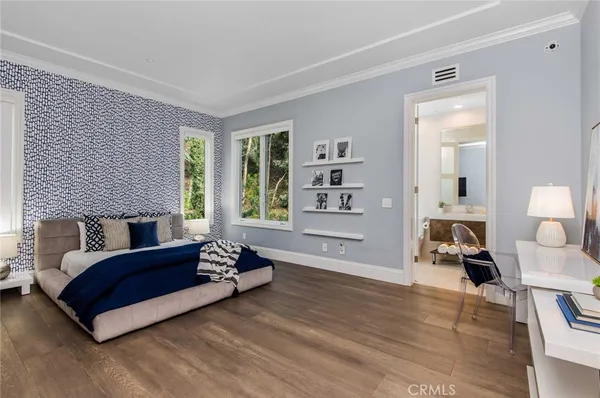 a living room with a flat screen tv and a fireplace