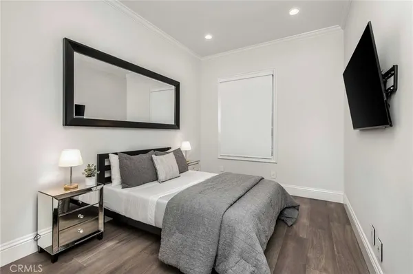 a white bench sitting in front of a house