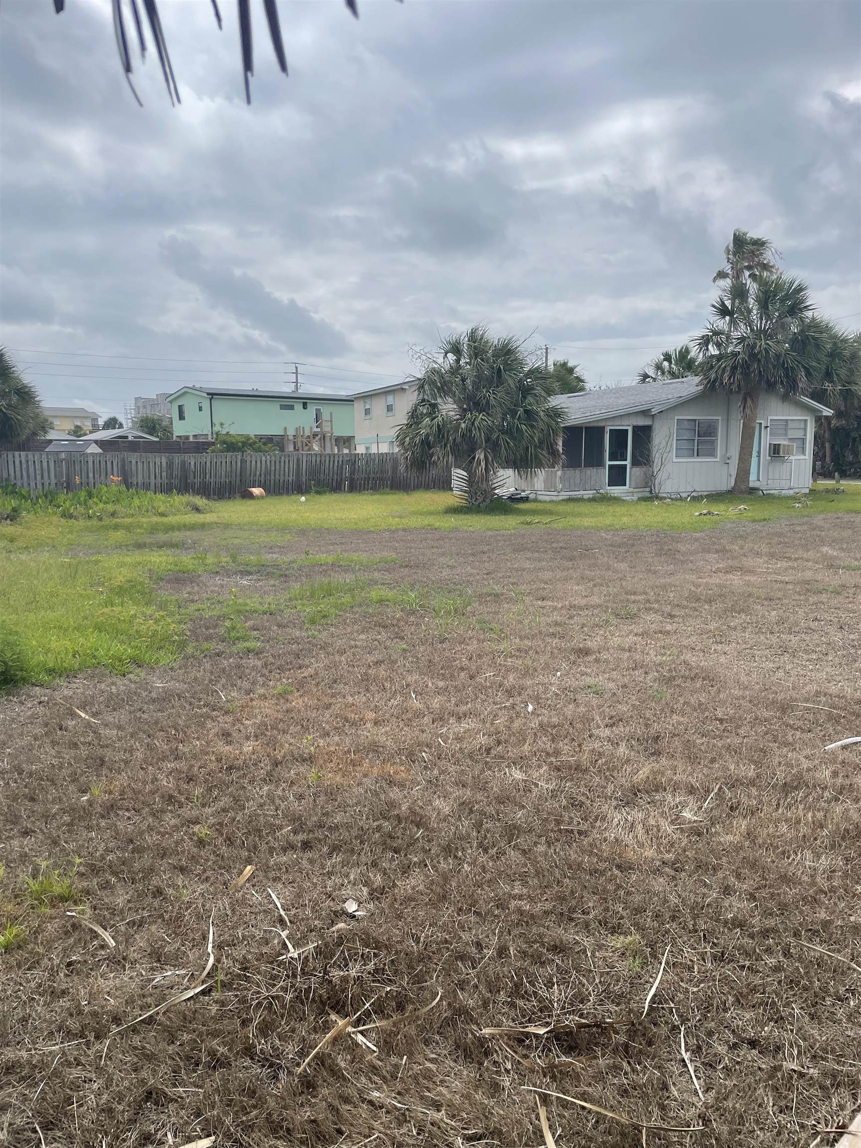 130 Gassett Road St. Augustine, FL 32080 - Photo 3 of 5 a view of a big house with a big yard and large trees