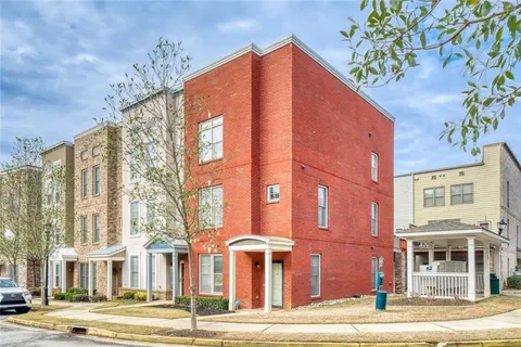 a blue building in front of a building