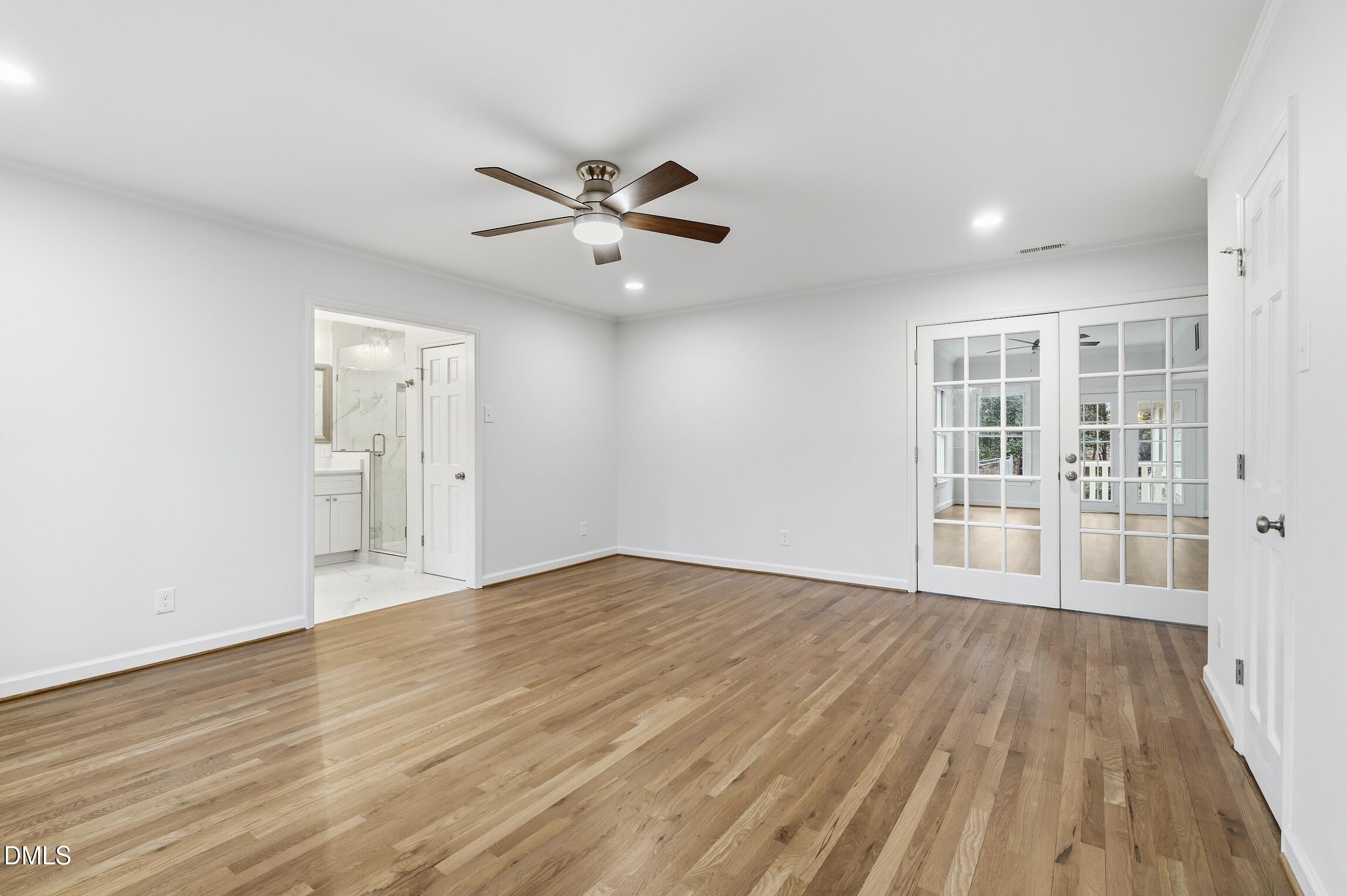1504 Homestead Road Chapel Hill, NC 27516 - Photo 11 of 39 a view of an empty room with a window and wooden floor