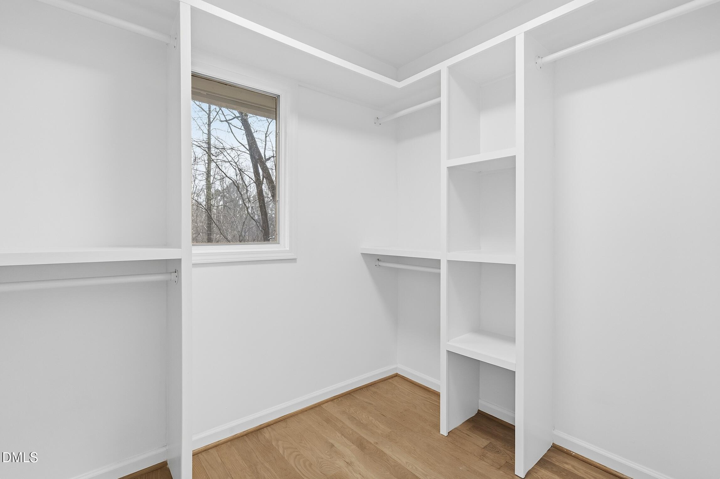 1504 Homestead Road Chapel Hill, NC 27516 - Photo 14 of 39 a view of an empty room with wooden floor and closet