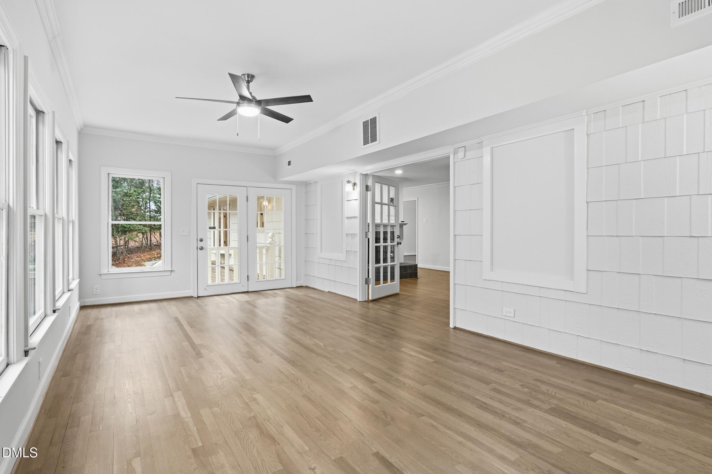 1504 Homestead Road Chapel Hill, NC 27516 - Photo 16 of 39 a view of an empty room with wooden floor and a window
