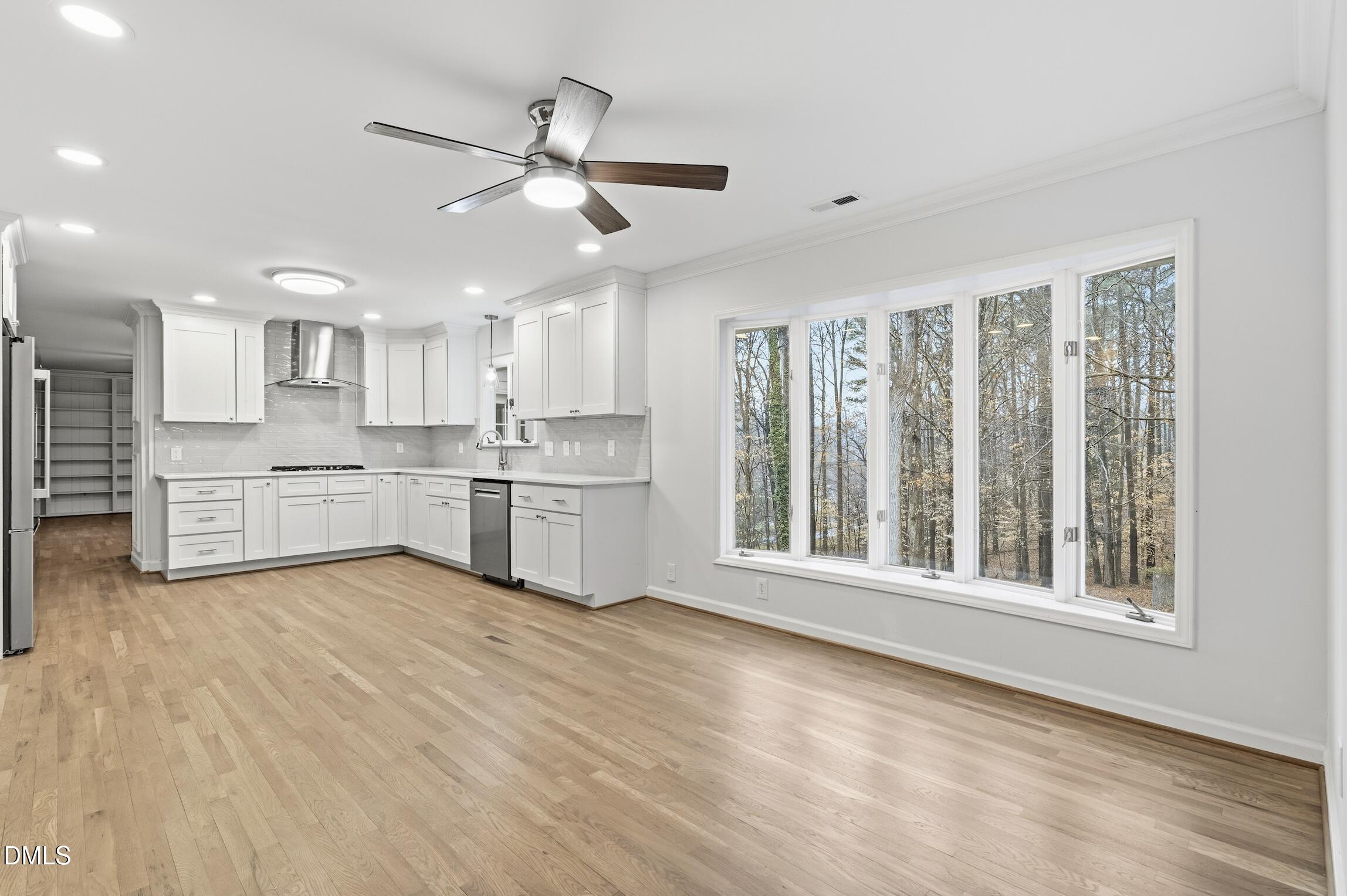 1504 Homestead Road Chapel Hill, NC 27516 - Photo 21 of 39 a view of kitchen with granite countertop cabinets and window