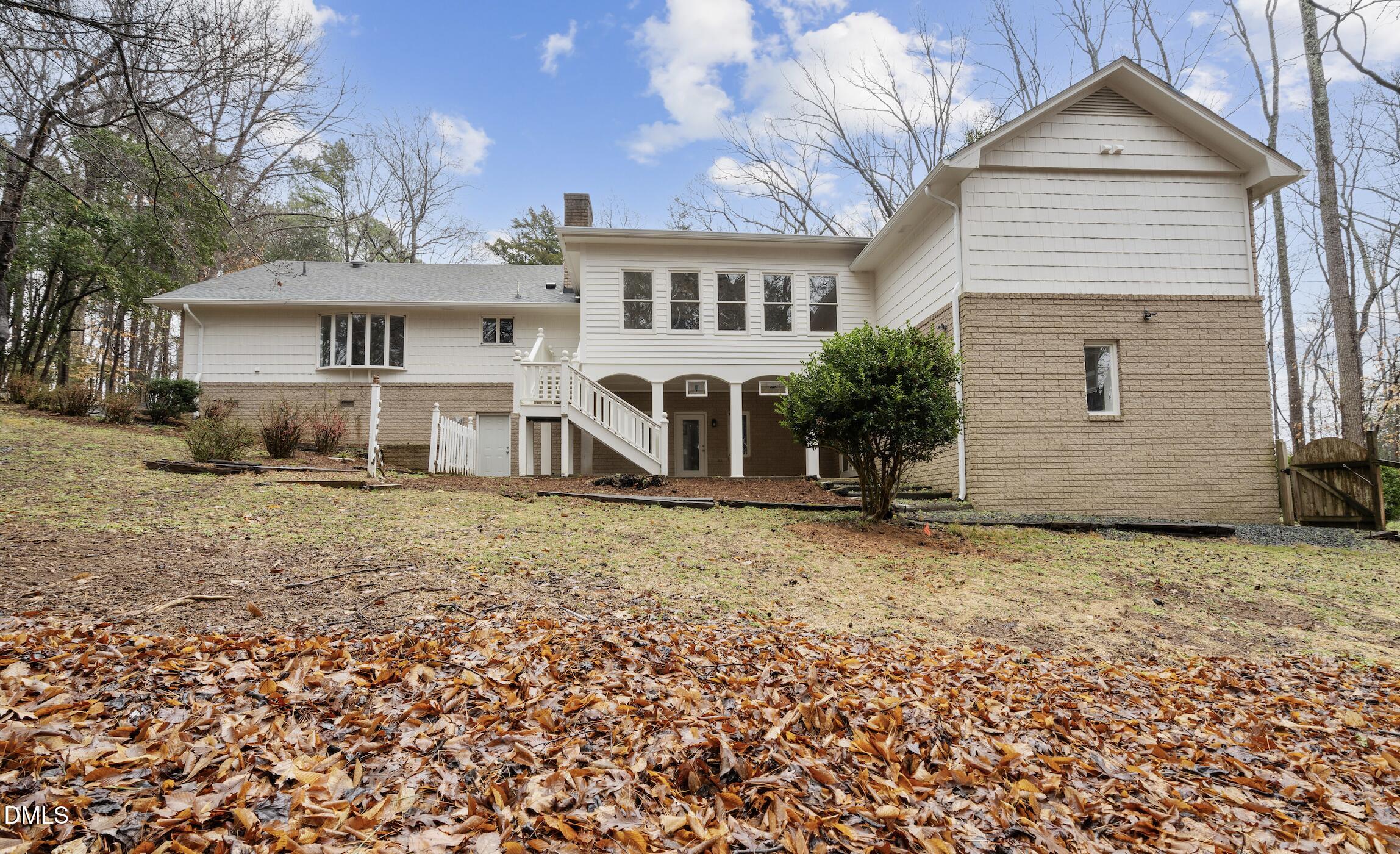 1504 Homestead Road Chapel Hill, NC 27516 - Photo 33 of 39 a view of a house with a yard