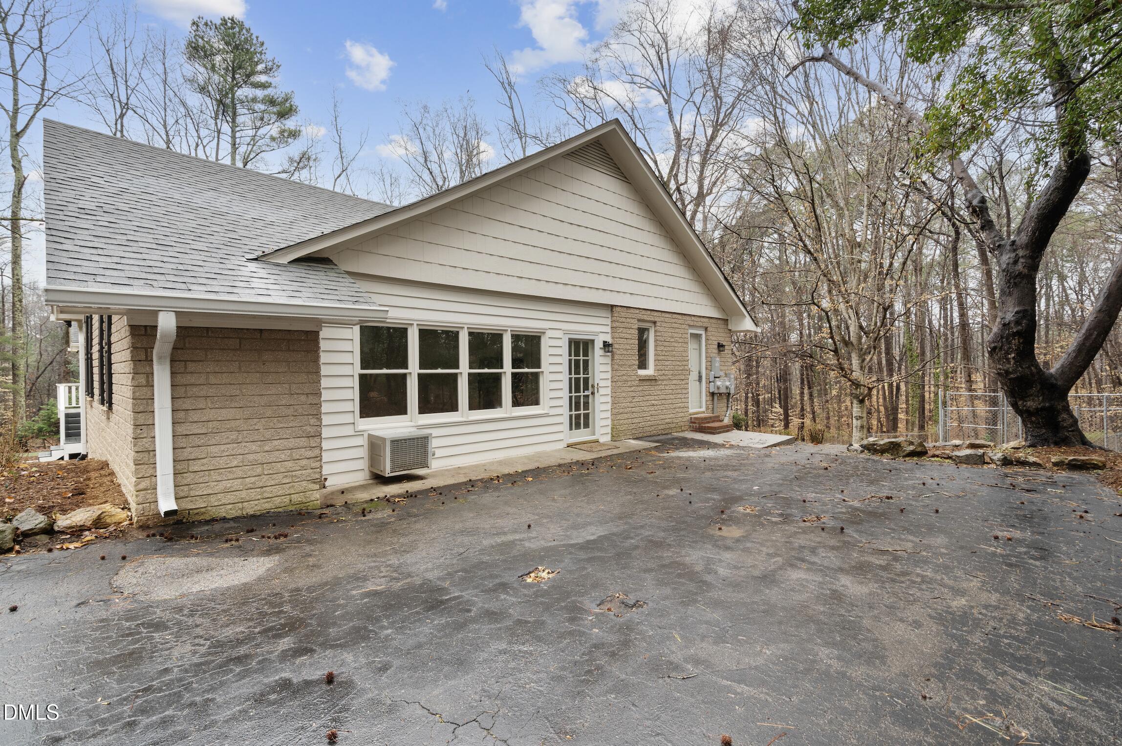 1504 Homestead Road Chapel Hill, NC 27516 - Photo 35 of 39 a view of house with a large tree