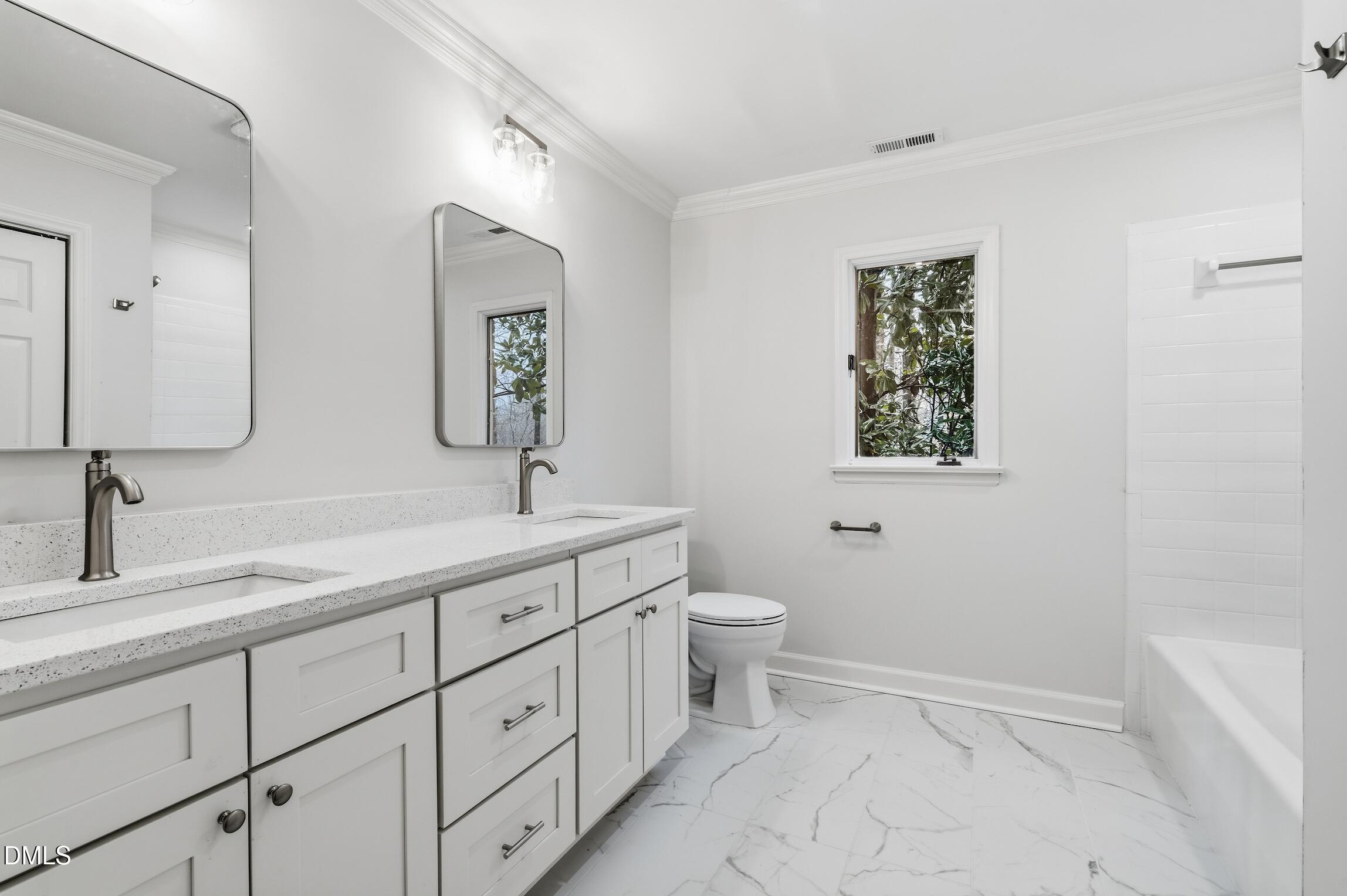 1504 Homestead Road Chapel Hill, NC 27516 - Photo 8 of 39 a bathroom with a toilet sink and mirror