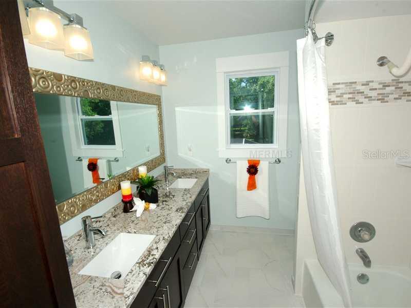 5017 Vanderipe Road Sarasota, FL 34241 - Photo 16 of 25 Bath2 - The guest bathroom has also received a beautiful makeover.