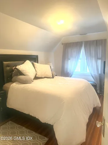 a bathroom with a toilet a sink and shower