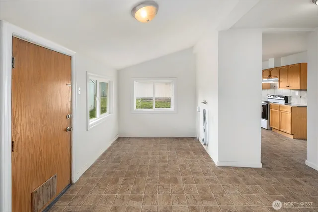 a view of a kitchen with a sink and a window