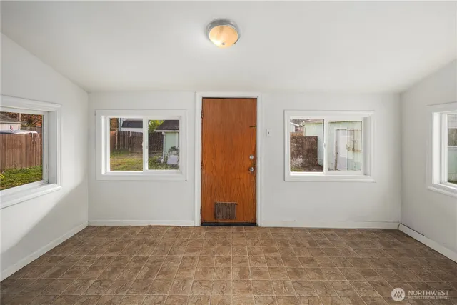 a view of an empty room with a window