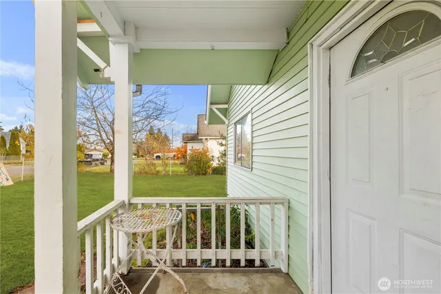 a view of balcony with wooden floor