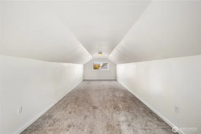 a view of a hallway with stairs