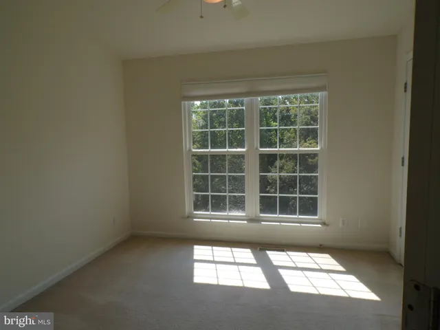 a view of an empty room and a window