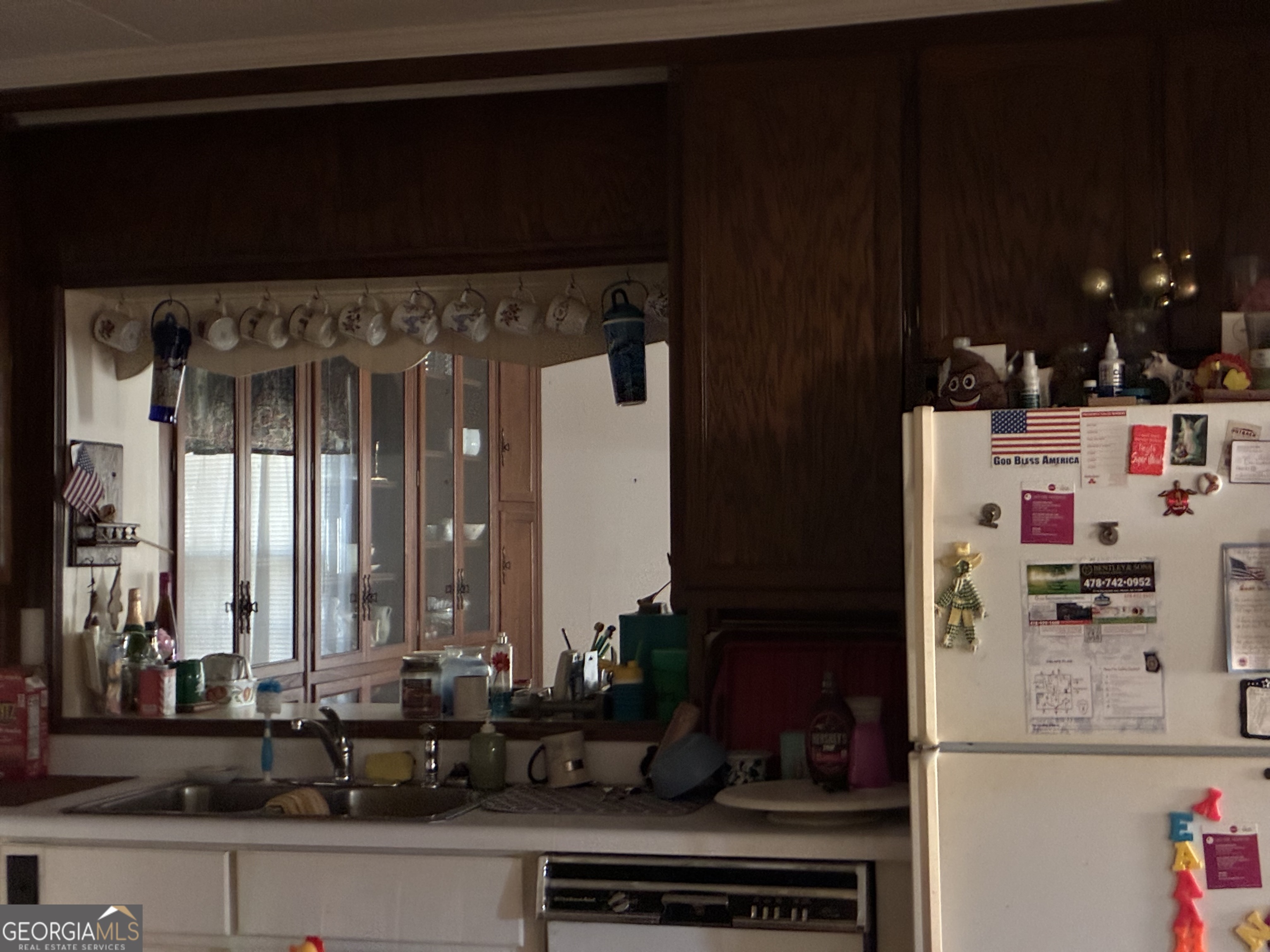 602 North Street Fort Valley, GA 31030 - Photo 21 of 40 a kitchen with a refrigerator and a counter top