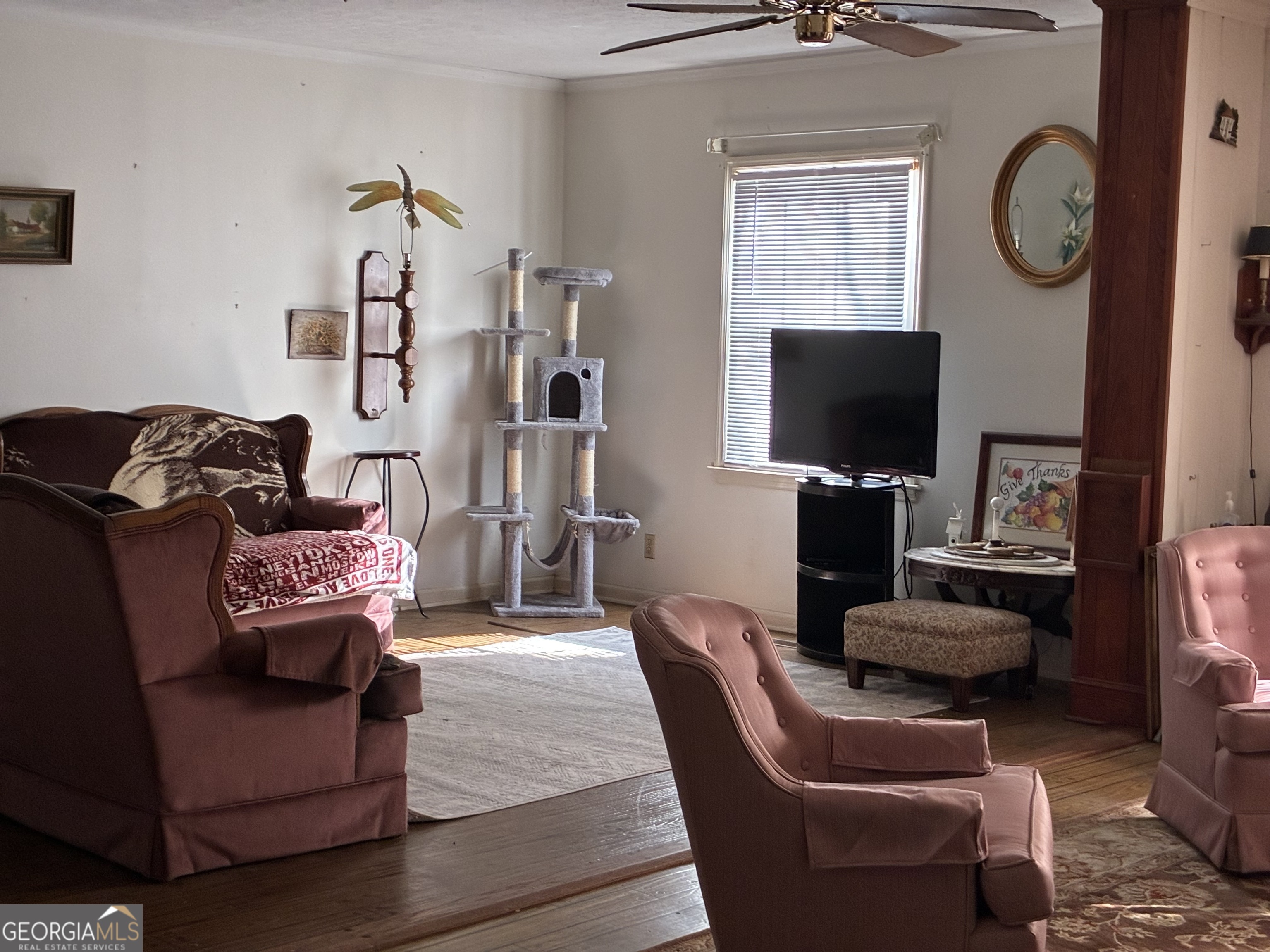 602 North Street Fort Valley, GA 31030 - Photo 6 of 40 a living room with furniture a flat screen tv and a window