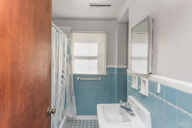 a bathroom with a toilet and a sink