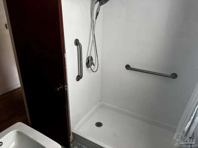 a view of a park with large trees