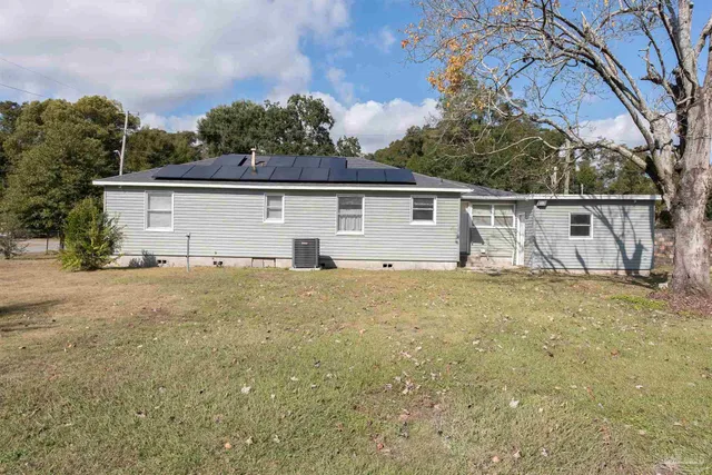 a house with trees in the background