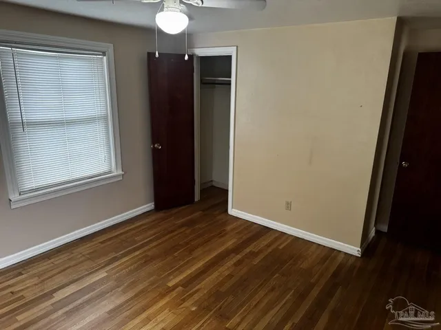 a view of empty room with windows