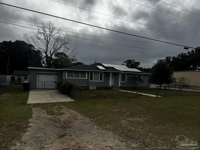 a view of workspace with wooden floor and windows