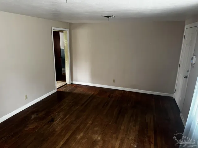 a kitchen with a refrigerator and a sink