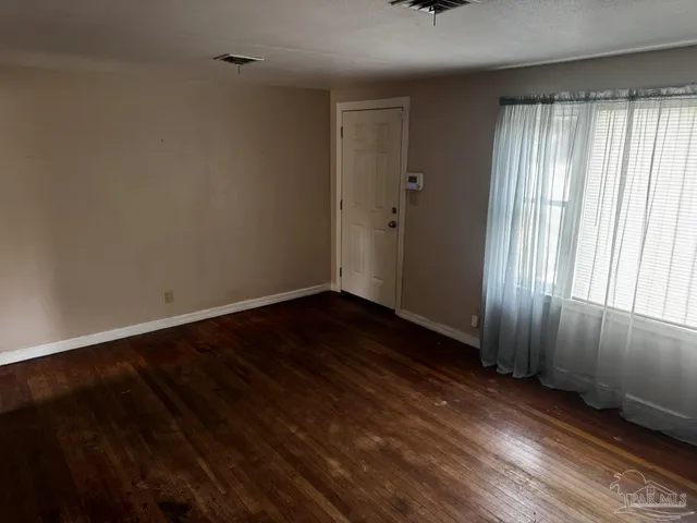 a stove top oven sitting inside of a kitchen