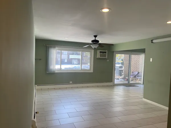 a view of an empty room with a window