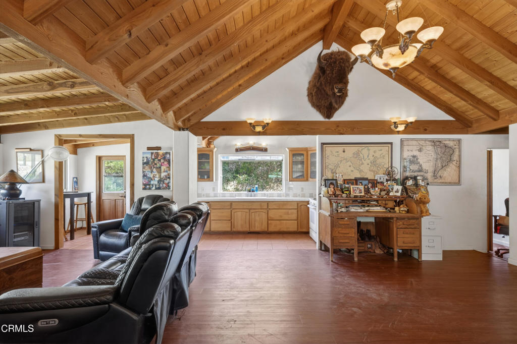 8416 Wheeler Canyon Road Santa Paula, CA 93060 - Photo 23 of 48 a dining room with furniture and a floor to ceiling window