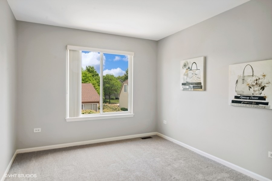 3090 Whitney Road Aurora, IL 60502 - Photo 16 of 24 an empty room with a window