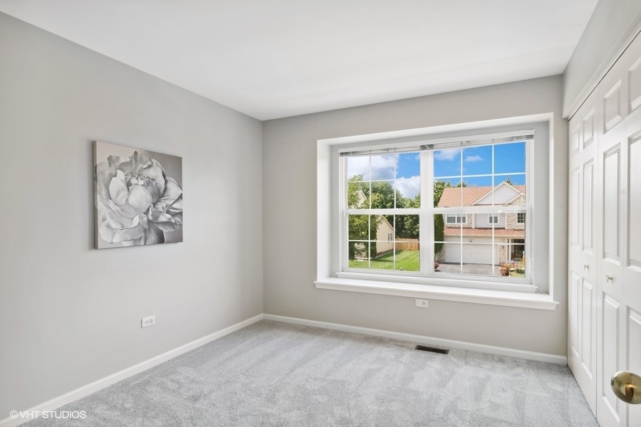 3090 Whitney Road Aurora, IL 60502 - Photo 17 of 24 an empty room with a window
