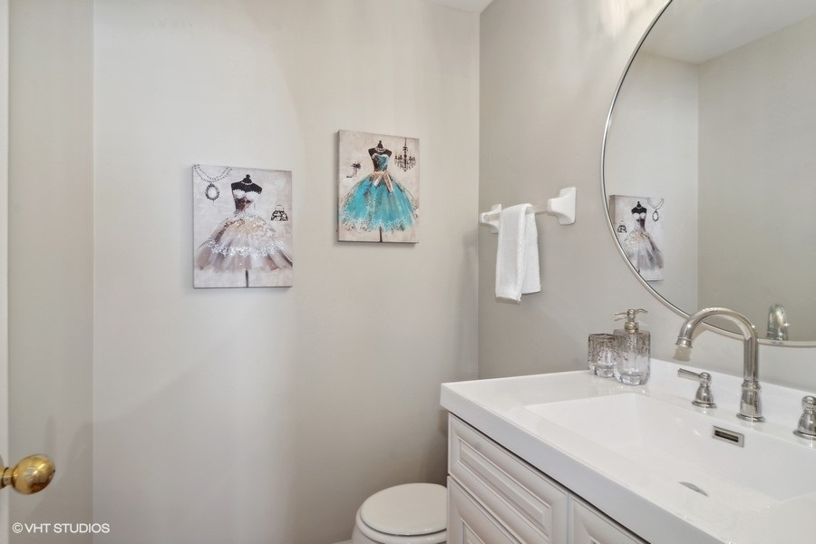 3090 Whitney Road Aurora, IL 60502 - Photo 19 of 24 a bathroom with a toilet sink and mirror