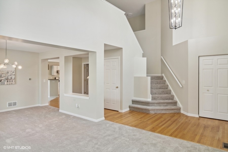 3090 Whitney Road Aurora, IL 60502 - Photo 2 of 24 wooden floor in an empty room with a gallery