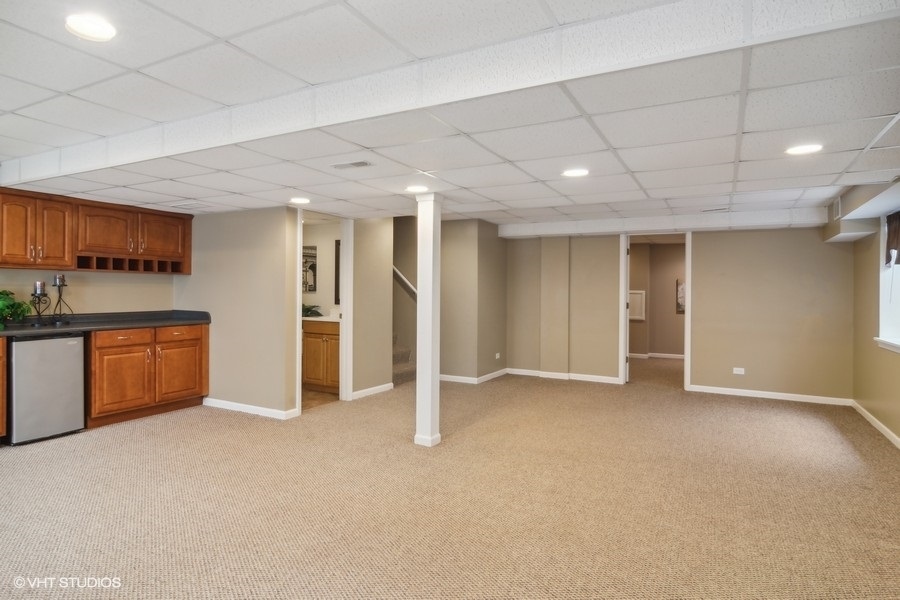 3090 Whitney Road Aurora, IL 60502 - Photo 21 of 24 a view of an empty room with kitchen and window