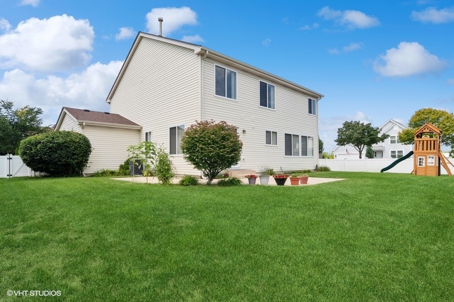 3090 Whitney Road Aurora, IL 60502 - Photo 24 of 24 a front view of a house with a yard
