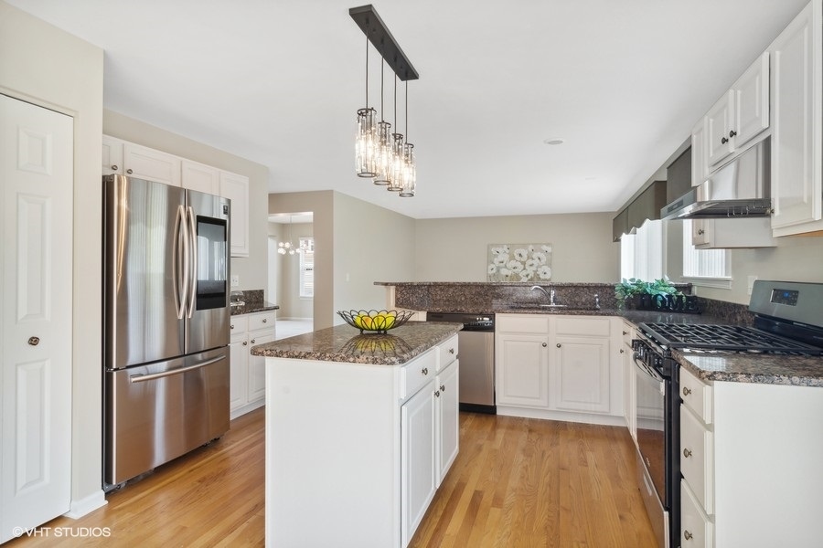 3090 Whitney Road Aurora, IL 60502 - Photo 7 of 24 a kitchen with a refrigerator a sink and dishwasher