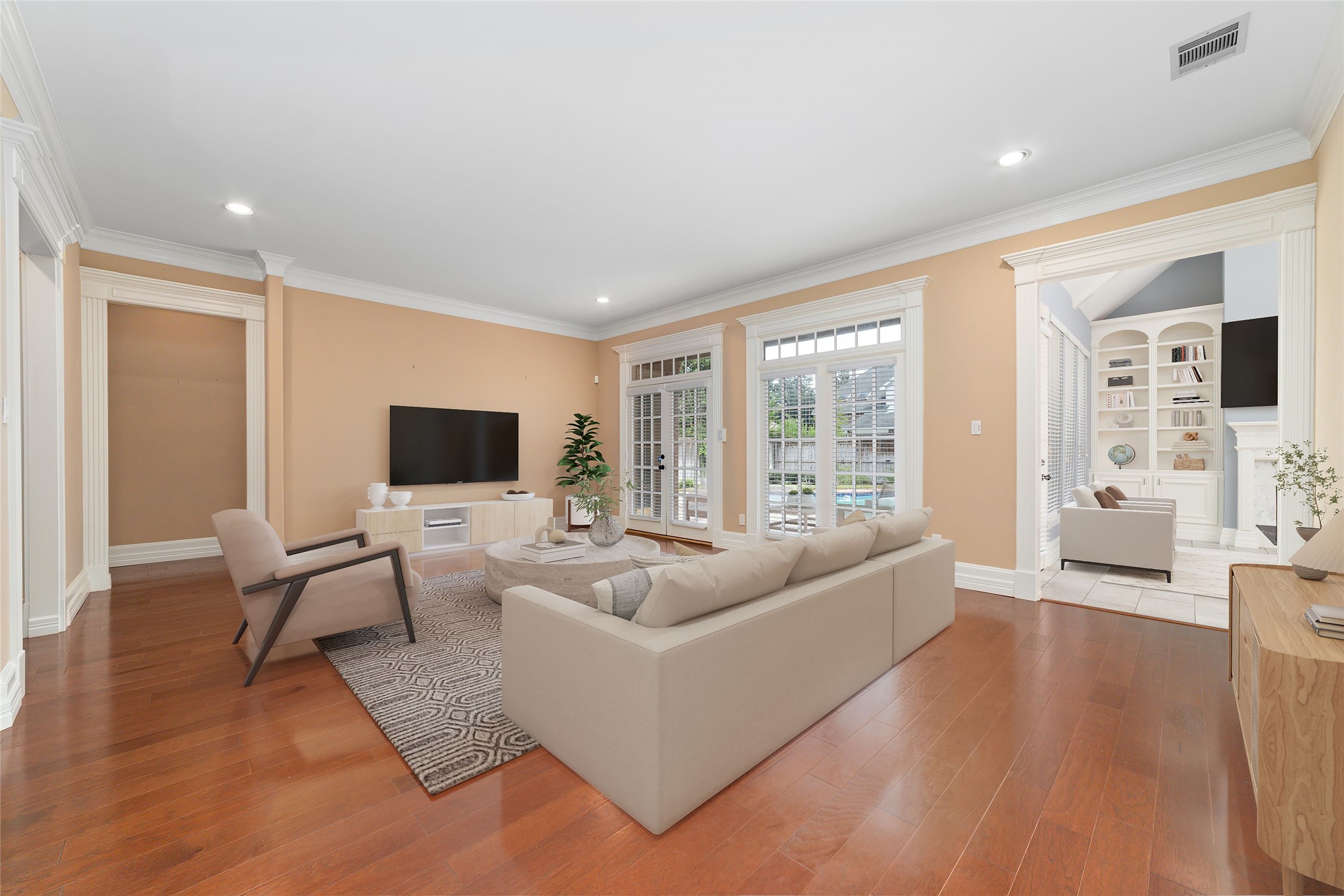 16114 Lafone Drive Spring, TX 77379 - Photo 7 of 45 Soaring ceilings and a wall of windows fill this spacious family room with natural light while offering beautiful views of the backyard and pool. Virtually staged.