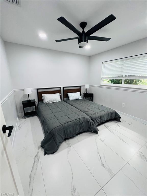 4439 Parrot Avenue Naples, FL 34104 - Photo 7 of 14 Bedroom featuring ceiling fan, marble finish flooring, and recessed lighting