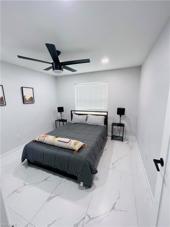 4439 Parrot Avenue Naples, FL 34104 - Photo 9 of 14 Bedroom with marble finish floors, ceiling fan, and recessed lighting