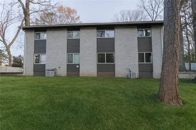a brick house with a small yard