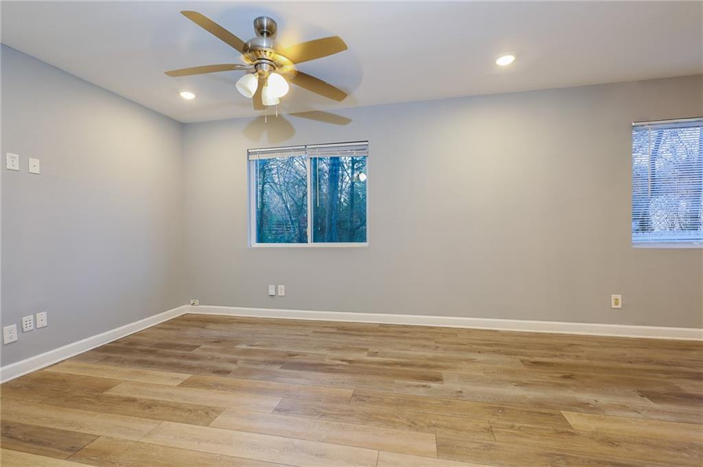 1277 Goodwin Road Northeast, Unit 1277 Atlanta, GA 30324 - Photo 3 of 15 wooden floor in an empty room with a window