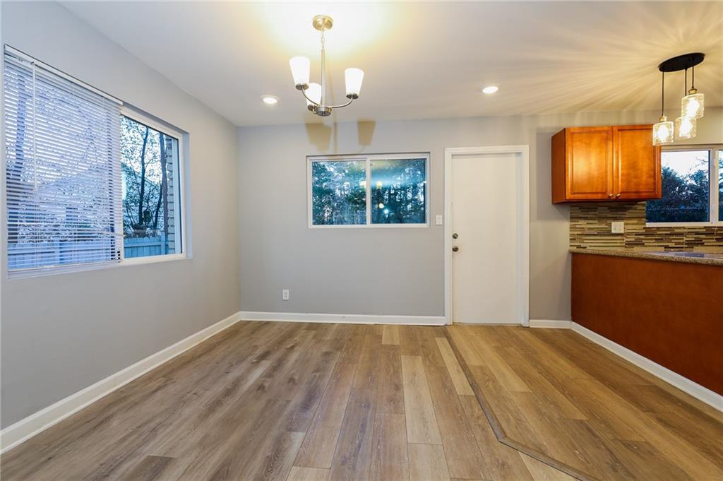 1277 Goodwin Road Northeast, Unit 1277 Atlanta, GA 30324 - Photo 5 of 15 a view of livingroom with kitchen