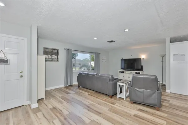 a view of living room with furniture and flat screen tv